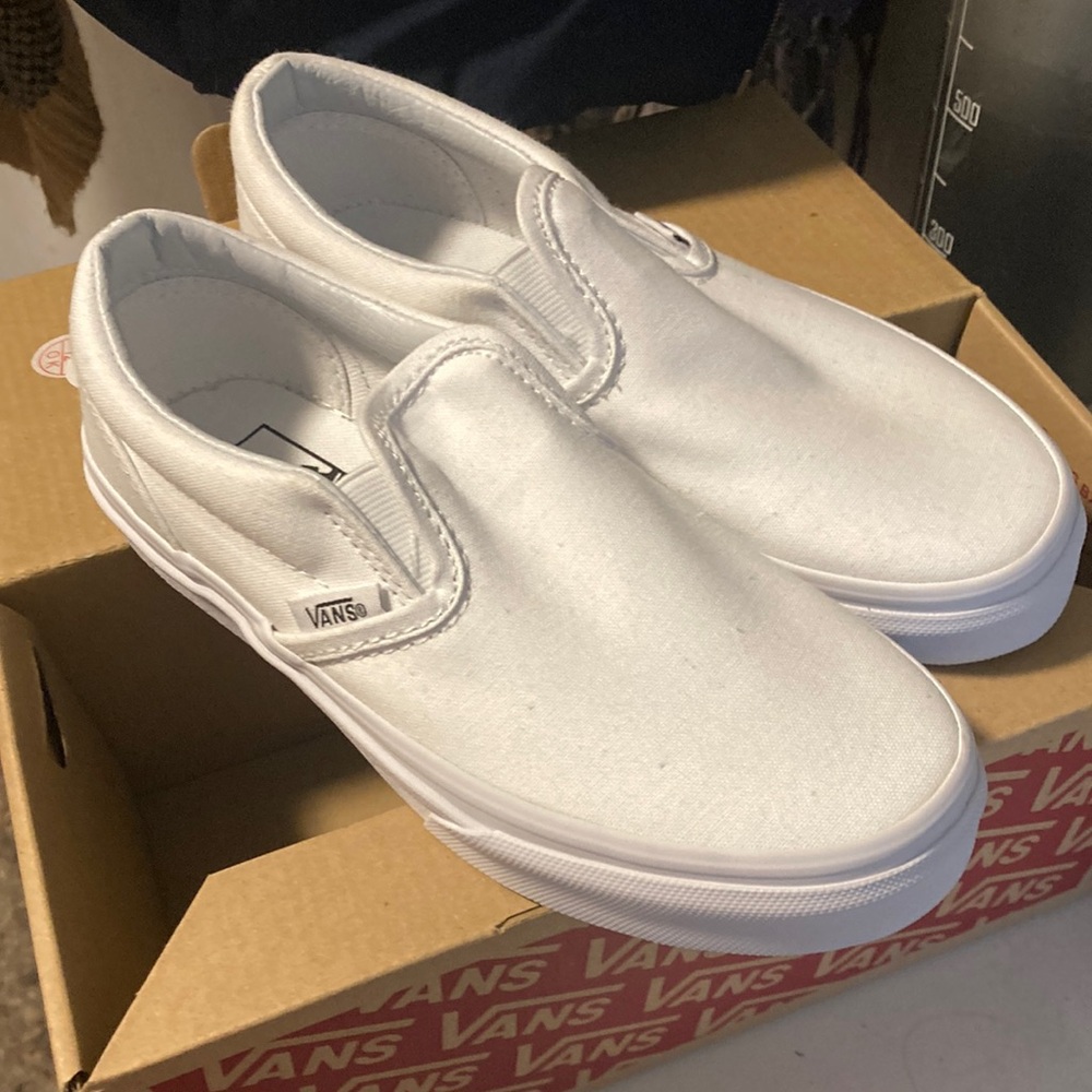 Girls canvas  white slip on vans new in box never worn.